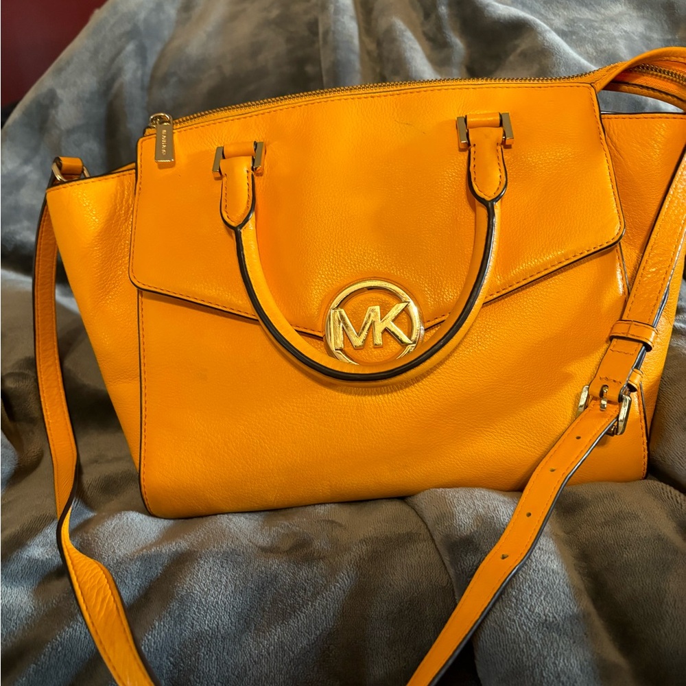 Stunning vibrant deep yellow Michael Kors bag. 12 in W 10in H 6 in D with COA